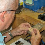 GoldFellow's Borrego examining 14K gold charm